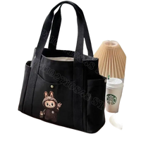 Black canvas tote bag with cartoon bunny.