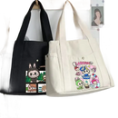 Two canvas tote bags with cartoon graphics.
