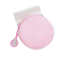 Round pink coin purse with zipper.