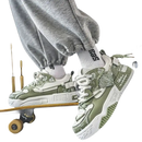 Green and white patterned sneakers.
