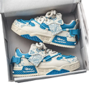 Pair of blue and white sneakers.