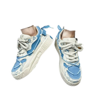 Blue and white patterned sneakers.
