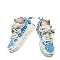 Blue and white patterned sneakers.