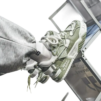Olive green and white patterned sneakers.