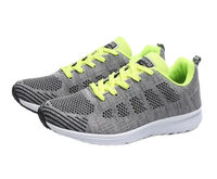 Gray and neon yellow running shoes.
