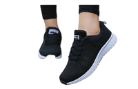 Black athletic shoes with white soles.