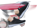 Black athletic shoes with white soles.