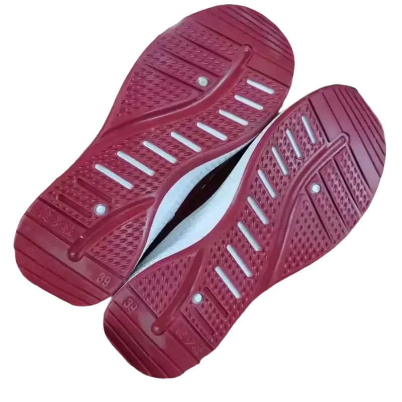 Red athletic shoe soles on trendy fashionable women’s sports shoes for sporty style
