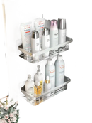 Two-tiered aluminum corner shelves filled with toiletries.
