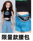 Doll wearing a black crop top, blue jeans, and a black fanny pack.