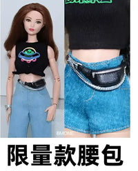 Doll wearing a black crop top, blue jeans, and a black fanny pack.