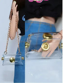 Clear purse with gold accents.