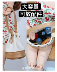 Miniature bucket bag with accessories.
