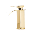 Gold-colored bathroom faucet.