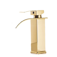 Gold-colored bathroom faucet.