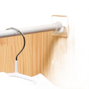 Adhesive-mounted closet rod.