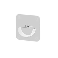 Adhesive wall hook.
