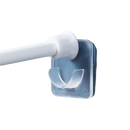 Clear adhesive curtain rod holder.