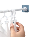 White plastic clothes drying rack.