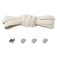 Beige shoelaces with metal locks.