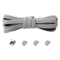 Light gray shoelaces with metal locks.