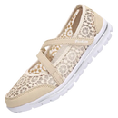 Beige lace-covered slip-on shoe.