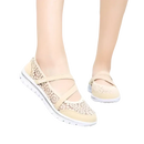Beige lace-covered walking shoes.