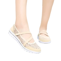 Beige lace-covered walking shoes.