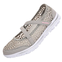 Gray lace-covered slip-on shoe.