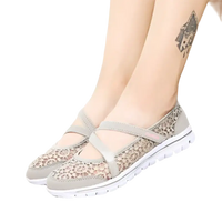 Gray lace-patterned slip-on shoes.