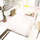 Pink desk with accessories.