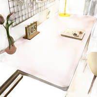 Pink desk with accessories.