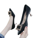 Black high-heeled pumps with jeweled buckle.