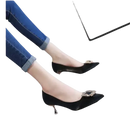 Black high heels with jeweled buckles.