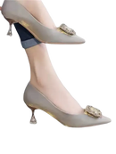 Gray high heels with jeweled embellishments.