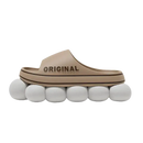 Beige slide sandal on white spheres.