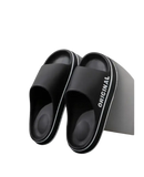 Black slide sandals.