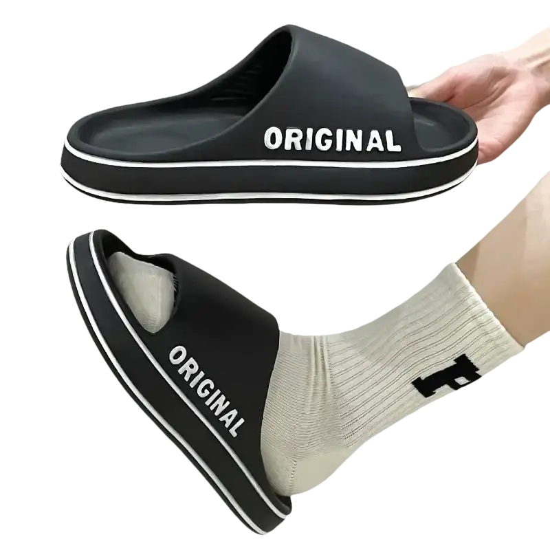 Black slide sandals with white trim.