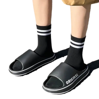 Black slides with white trim.