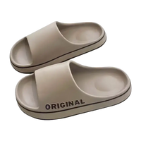 Beige slide sandals.