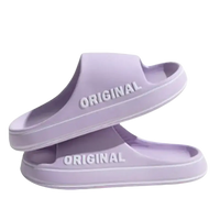Lavender-colored slide sandals.