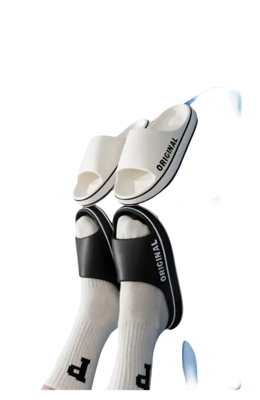 White and black ’Original’ slide sandals.
