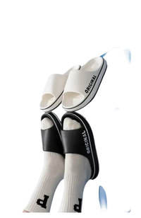 White and black ’Original’ slide sandals.
