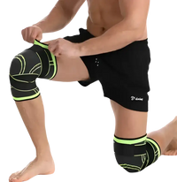 Black and green knee compression sleeves.