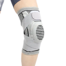 Gray knee brace with straps.