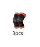 Pair of black and orange knee braces.