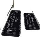 Black kitchen mats with white lettering and utensil designs.