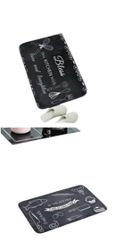 Black kitchen floor mats with white kitchen-themed drawings.