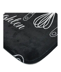 Black kitchen mat with white utensil designs.