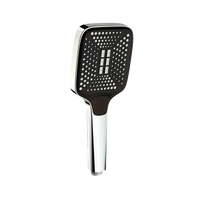 Chrome and black square shower head.